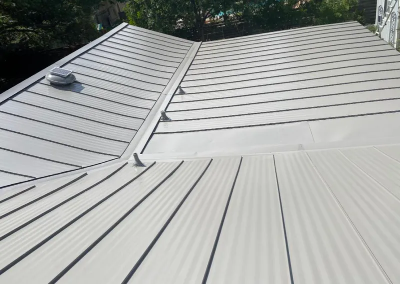 Solar attic fan installed on a metal roof for Roof Ventilation in Balch Springs
